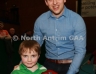 Aaron McHenry from Central Restaurant Ballycastle presenting Michael Davitts Swatragh team captain Davin Hasson with the Central Restaurant U8 Indoor Hurling Division 5 Shield